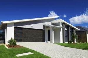 clopay modern steel collection steel-panel garage doors on white house